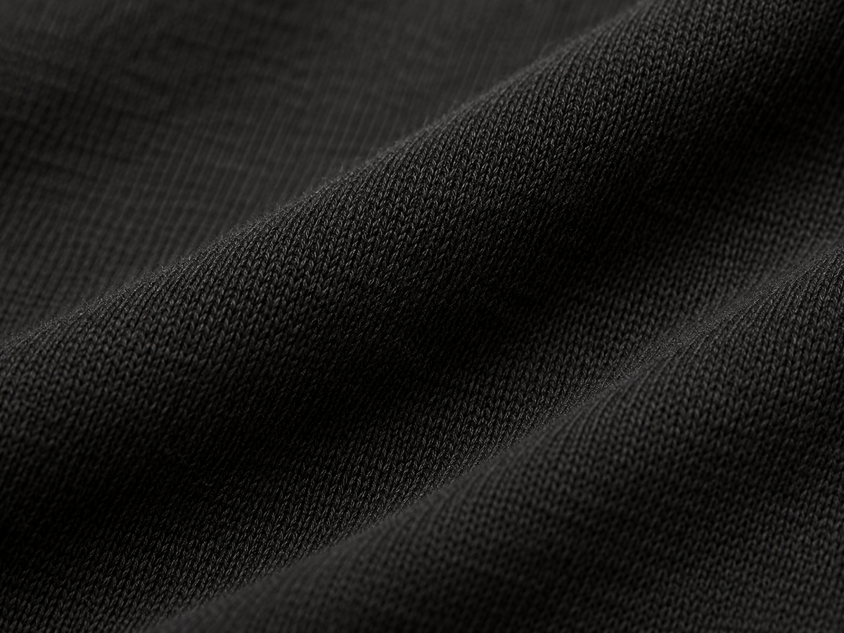 Macro detail of premium black jersey fabric